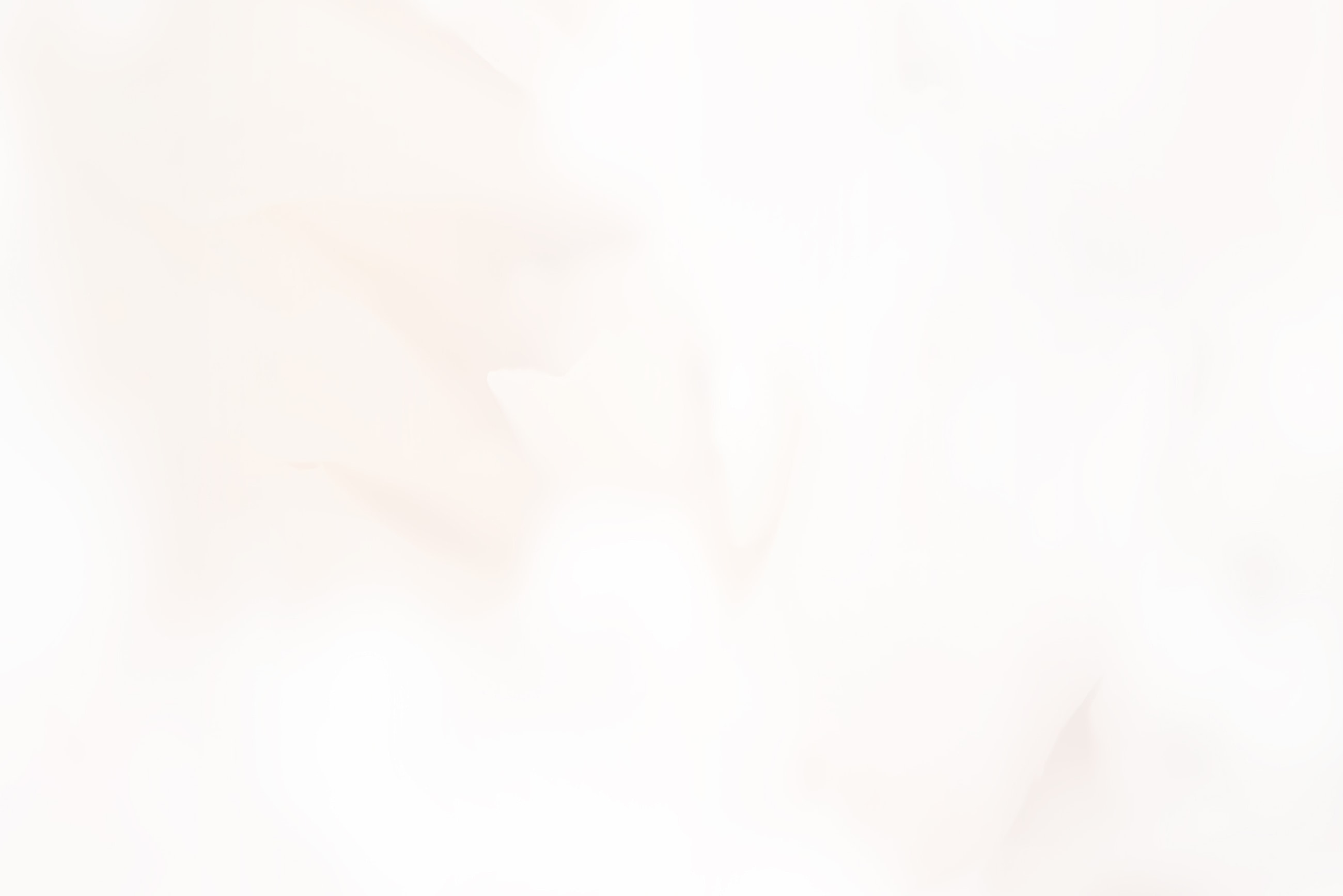 Soft, blurred white background texture.