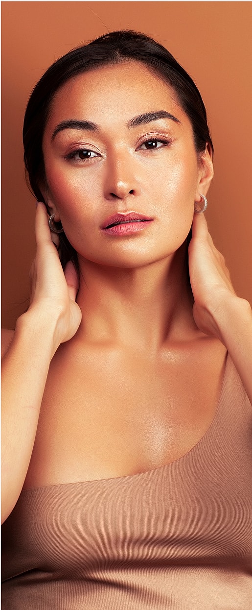 Portrait of a woman with a neutral background.
