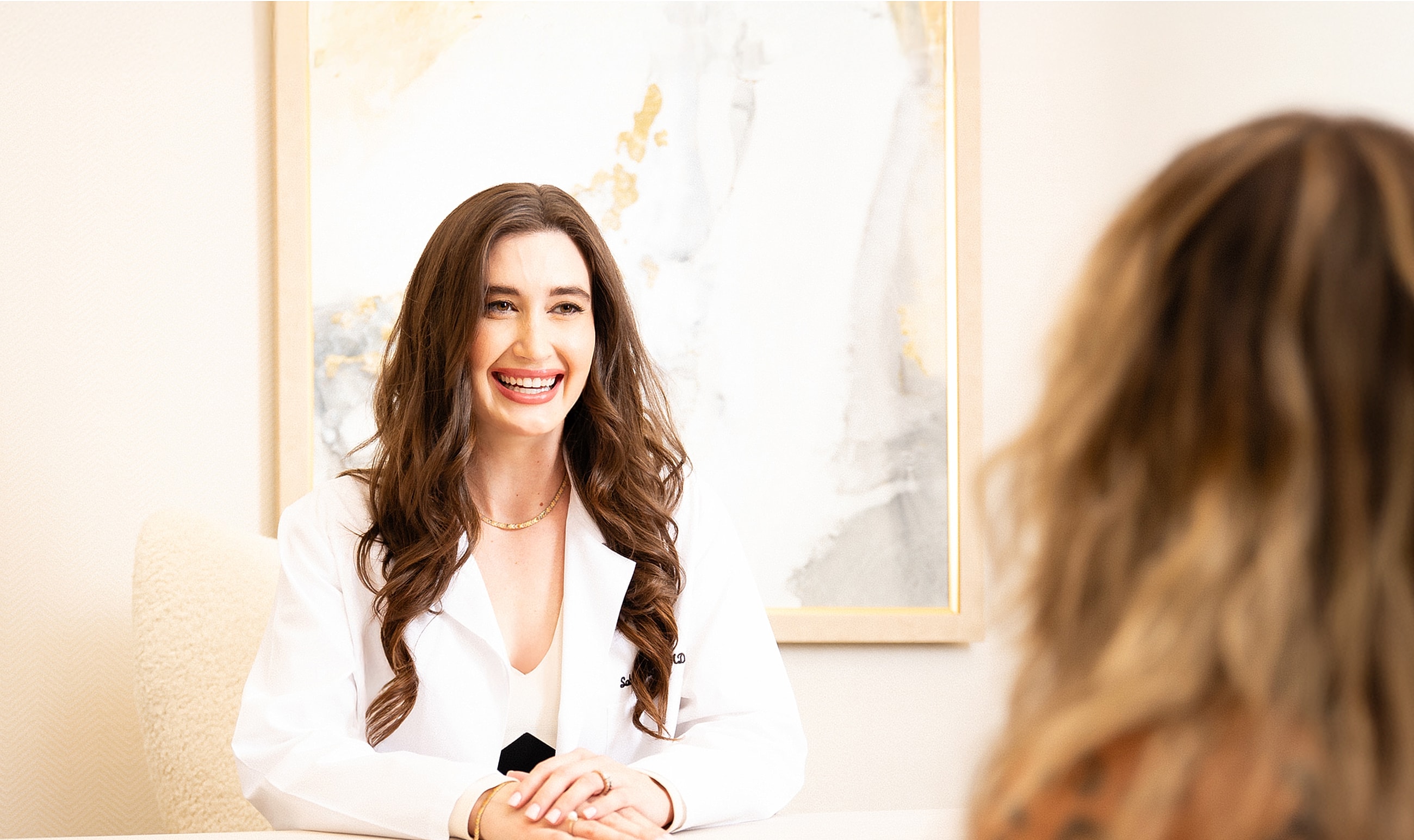 Smiling healthcare professional consulting with patient.